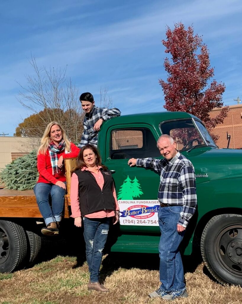 Carolina Fundraisers family picture - group standing in front of delivery truck with the Butter Braid Pastry logo on it.