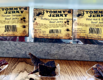 Ship 2 Home program - 3 bags of tommy's jerky with jerky pieces in front of each